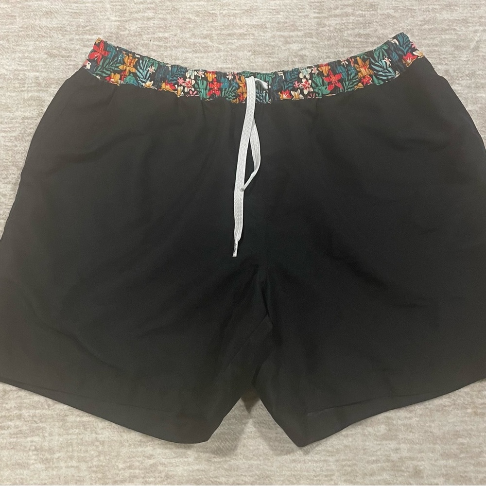 Chubbies Black Swim Trunks with Vibrant Floral Trim, Size Large.